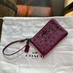 Coach metallic purple leather wristlet pouch with stars and studs- never used